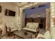 Relaxing covered patio with comfortable seating, coffee table, and decorative lighting for evening enjoyment at 4519 N 29Th Way, Phoenix, AZ 85016