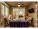 Inviting covered patio with comfortable seating, string lights, and sliding glass doors to the dining area at 4519 N 29Th Way, Phoenix, AZ 85016