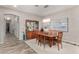 Elegant dining room with wood table and chairs, chandelier, and decorative display cabinet at 4519 N 29Th Way, Phoenix, AZ 85016