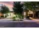 Charming stone home with manicured landscaping and warm exterior lighting at 4519 N 29Th Way, Phoenix, AZ 85016