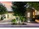 Charming stone home with manicured landscaping and warm exterior lighting at 4519 N 29Th Way, Phoenix, AZ 85016