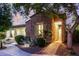 Charming stone home with manicured landscaping and warm exterior lighting at 4519 N 29Th Way, Phoenix, AZ 85016