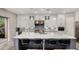 Bright kitchen with white cabinets, stainless steel appliances, mosaic backsplash, and a spacious island at 4519 N 29Th Way, Phoenix, AZ 85016