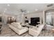 Spacious living room with a ceiling fan, fireplace, and a comfortable white sofa at 4519 N 29Th Way, Phoenix, AZ 85016