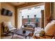 Private outdoor patio with comfortable seating, mounted TV, and manicured plants for a relaxing retreat at 4519 N 29Th Way, Phoenix, AZ 85016