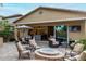 Well-appointed outdoor patio with a fire pit, dining area, and views of the open-concept kitchen and living room at 4519 N 29Th Way, Phoenix, AZ 85016