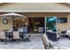 Expansive patio with outdoor dining, comfortable seating, and views of the kitchen and living spaces through sliding glass doors at 4519 N 29Th Way, Phoenix, AZ 85016