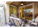 Relaxing outdoor patio with plush seating, ceiling fan, and a view into the home through sliding glass doors at 4519 N 29Th Way, Phoenix, AZ 85016