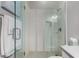 Glass shower features modern fixtures and bright, neutral finishes at 4519 N 29Th Way, Phoenix, AZ 85016
