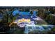 Expansive aerial view featuring luxury home with a pool, sports court, and beautiful landscaping near a tranquil lake at 5 E Oakwood Hills Dr, Chandler, AZ 85248