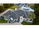 Aerial view of the grand estate showing a large yard, swimming pool, tennis and basketball court at 5 E Oakwood Hills Dr, Chandler, AZ 85248