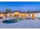 Spacious backyard featuring a pool and spa surrounded by sleek white tile, ideal for summer gatherings and fun at 5 E Oakwood Hills Dr, Chandler, AZ 85248