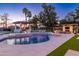 Lush backyard featuring a pool, cabana, and outdoor kitchen, perfect for entertaining and enjoying the outdoors at 5 E Oakwood Hills Dr, Chandler, AZ 85248