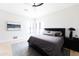 Bright bedroom featuring a ceiling fan, modern décor, and a comfortable bed, creating a relaxing atmosphere at 5 E Oakwood Hills Dr, Chandler, AZ 85248