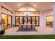 Chic outdoor dining area with modern furniture, offering a seamless transition to the luxurious interior at 5 E Oakwood Hills Dr, Chandler, AZ 85248