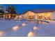 Rear exterior showcasing the house with a pool, spa, large sliding glass doors, and a covered patio for outdoor living at 5 E Oakwood Hills Dr, Chandler, AZ 85248