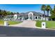 An inviting home with professional landscaping, a circular driveway, and a portico at 5 E Oakwood Hills Dr, Chandler, AZ 85248