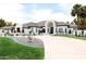 Elegant single-Gathering home with circular driveway, manicured lawn, and charming landscaping at 5 E Oakwood Hills Dr, Chandler, AZ 85248