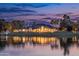 Waterfront home with manicured lawns, creating a picturesque setting that reflects sophistication and tranquility at 5 E Oakwood Hills Dr, Chandler, AZ 85248