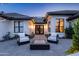 A comfortable and welcoming front porch with modern patio seating and a firepit at 5 E Oakwood Hills Dr, Chandler, AZ 85248