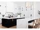 Bright, modern kitchen with white cabinets, marble countertops, and a contrasting island at 5 E Oakwood Hills Dr, Chandler, AZ 85248