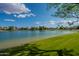 Picturesque lakeside scenery with clear water, verdant lawns, and blue skies at 5 E Oakwood Hills Dr, Chandler, AZ 85248