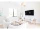 Bright living room boasting neutral tones, large windows, and stylish furnishings, creating an inviting and comfortable atmosphere at 5 E Oakwood Hills Dr, Chandler, AZ 85248