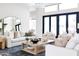 Bright living room with comfortable white seating, modern coffee table, and stylish decor at 5 E Oakwood Hills Dr, Chandler, AZ 85248