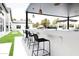 Stylish outdoor bar area with comfortable seating, perfect for entertaining and enjoying the outdoors at 5 E Oakwood Hills Dr, Chandler, AZ 85248