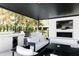 Comfortable outdoor living space with a fireplace, television, and a well-equipped outdoor kitchen at 5 E Oakwood Hills Dr, Chandler, AZ 85248