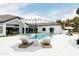 Beautiful backyard with a sparkling pool, lounge chairs, and a stylish white umbrella at 5 E Oakwood Hills Dr, Chandler, AZ 85248