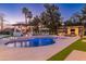 Outdoor paradise with a sparkling pool, spa, cozy seating, a pergola, a lounge area, and lush landscaping at 5 E Oakwood Hills Dr, Chandler, AZ 85248