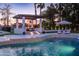 Inviting pool with a cozy cabana, soothing water features, and lush landscaping, perfect for relaxation and entertainment at 5 E Oakwood Hills Dr, Chandler, AZ 85248