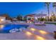 Outdoor pool area featuring a gorgeous pool, spa, sun loungers, a pergola, and ambient lighting for a relaxing ambiance at 5 E Oakwood Hills Dr, Chandler, AZ 85248