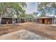 Large backyard featuring various sheds, trees and patio areas, fenced in with a wooden fence at 512 N Ironwood --, Mesa, AZ 85201