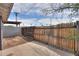 Large backyard featuring wooden fence surrounding a patio and an adjacent cinder block wall at 512 N Ironwood --, Mesa, AZ 85201