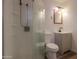 Modern bathroom featuring glass shower enclosure, vanity with framed mirror, and toilet at 512 N Ironwood --, Mesa, AZ 85201