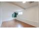 A bright bedroom featuring wood-look flooring and a painted accent wall at 512 N Ironwood --, Mesa, AZ 85201