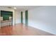 A well-lit bedroom with built-in shelving, wood floors, and green curtain accents at 512 N Ironwood --, Mesa, AZ 85201