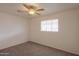 Cozy bedroom with a ceiling fan, window, and neutral carpet, offering a comfortable atmosphere at 512 N Ironwood --, Mesa, AZ 85201