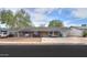 Charming single-story home featuring a cozy front porch with hanging swing and modern outdoor seating at 512 N Ironwood --, Mesa, AZ 85201