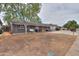 Charming single-story home featuring a cozy front porch with hanging swing and modern outdoor seating at 512 N Ironwood --, Mesa, AZ 85201