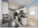 Well-lit kitchen featuring stainless steel appliances, tile countertops, and modern cabinets at 512 N Ironwood --, Mesa, AZ 85201