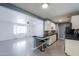 Open kitchen featuring modern appliances, breakfast bar, and seamless flow to living areas at 512 N Ironwood --, Mesa, AZ 85201