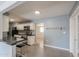 Open kitchen featuring modern appliances, breakfast bar, and seamless flow to living areas at 512 N Ironwood --, Mesa, AZ 85201