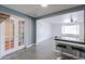 Open kitchen featuring modern appliances, breakfast bar, and seamless flow to living areas at 512 N Ironwood --, Mesa, AZ 85201