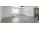 Bright living room featuring polished concrete floors, large window, and front door at 512 N Ironwood --, Mesa, AZ 85201
