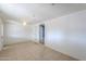 An open living space with light-colored walls, tile flooring, and French doors at 512 N Ironwood --, Mesa, AZ 85201