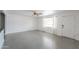 Bright living room featuring polished concrete floors and a view of the front door and adjacent kitchen at 512 N Ironwood --, Mesa, AZ 85201