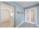 An open living space with light-colored walls, ceramic tile flooring, and French doors at 512 N Ironwood --, Mesa, AZ 85201